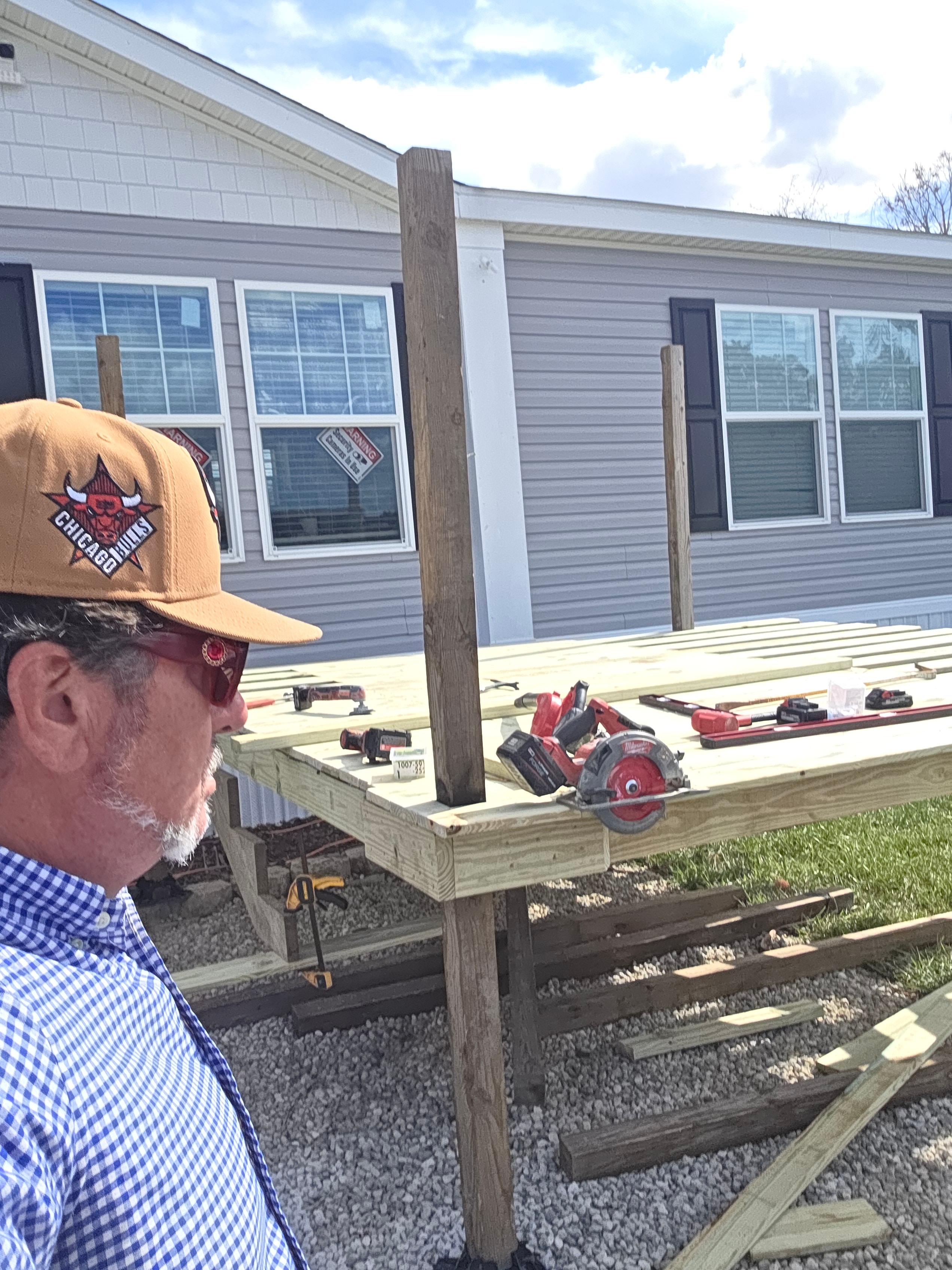 David Gilley and the Red Star construction team smiling on the job site in safety vests.