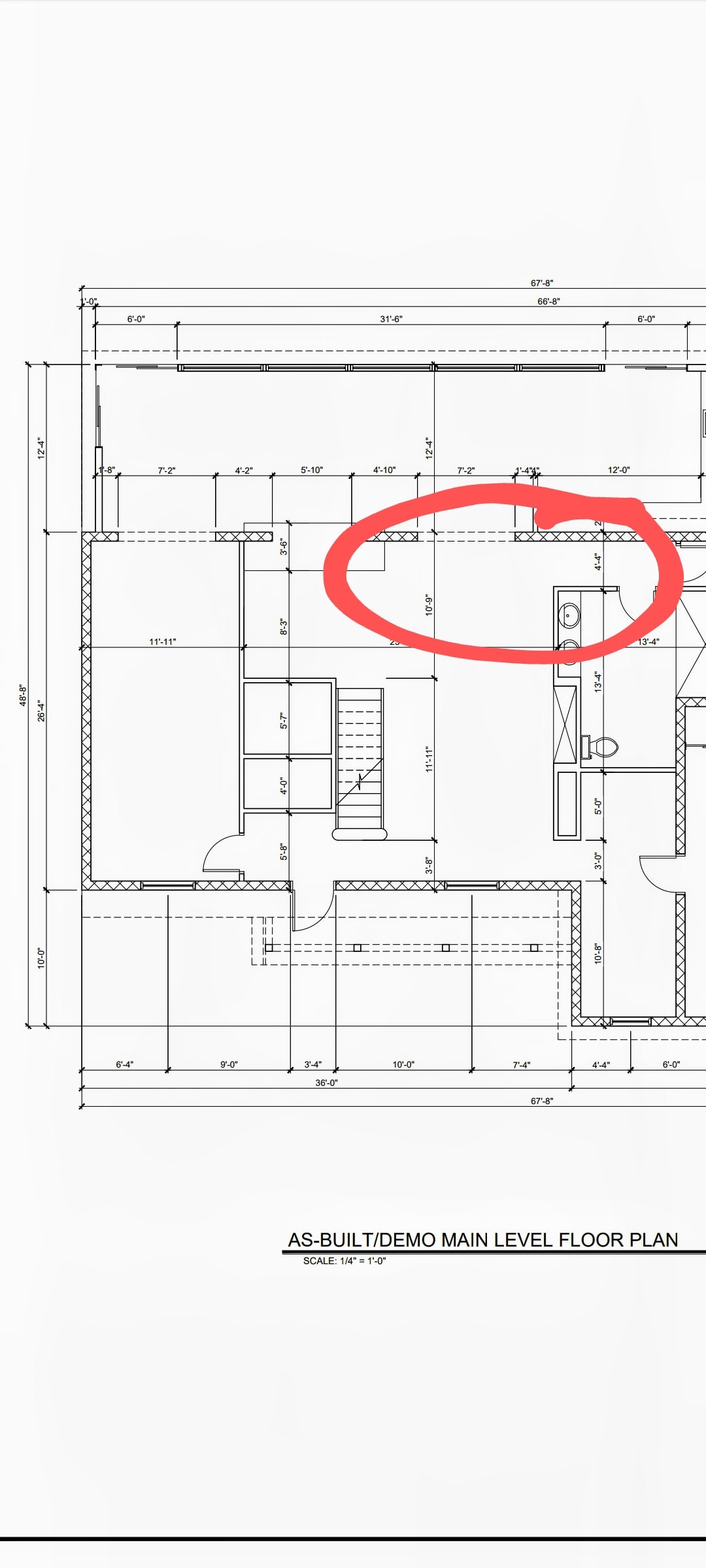 David Gilley pointing out key details on the hand-drawn floor plan for the Gilley Residence renovation project.