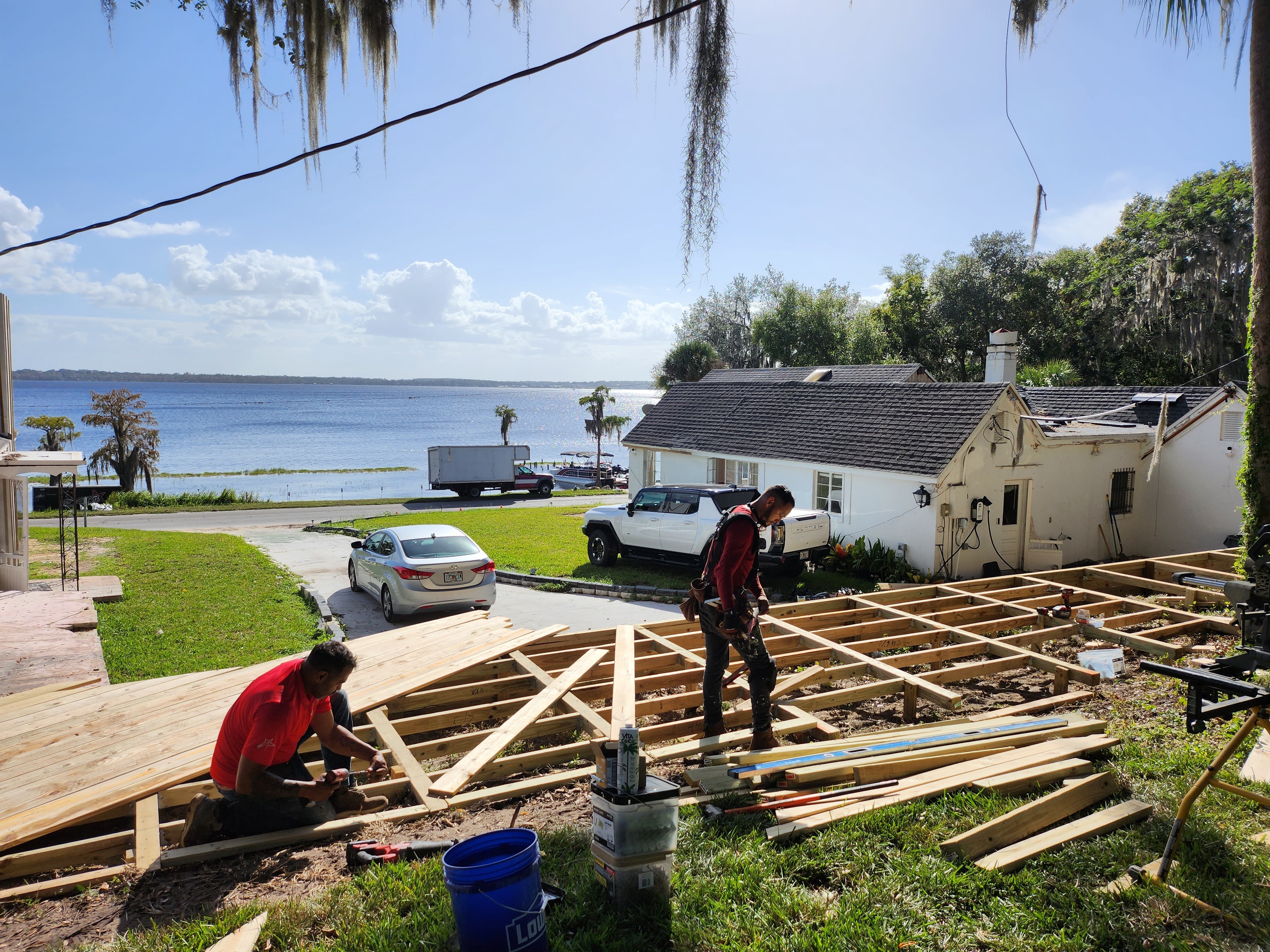 Red Star crew framing a lakefront deck at a waterfront property with stunning lake views.