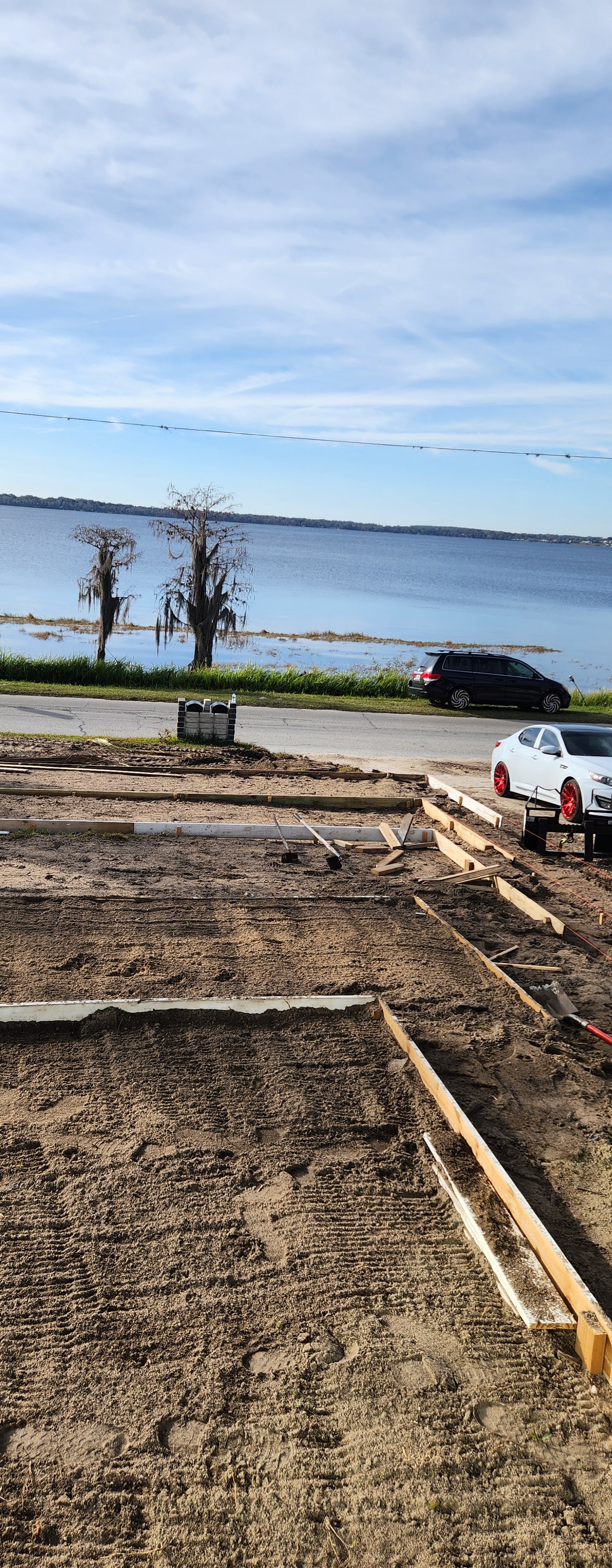 Red Star team renovating a luxury Mediterranean-style home with scaffolding and tile roof work.