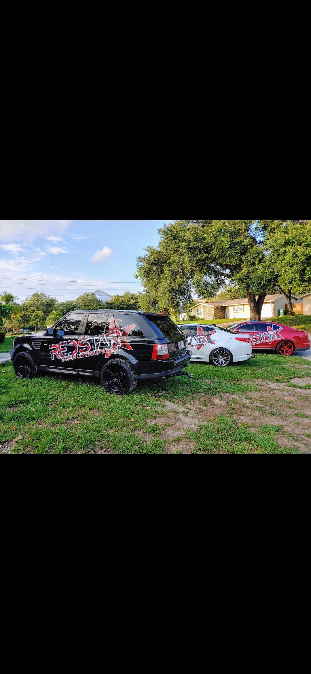 Three Red Star Luxury Coating Specialist branded vehicles lined up — Range Rover, sedan, and sports car.