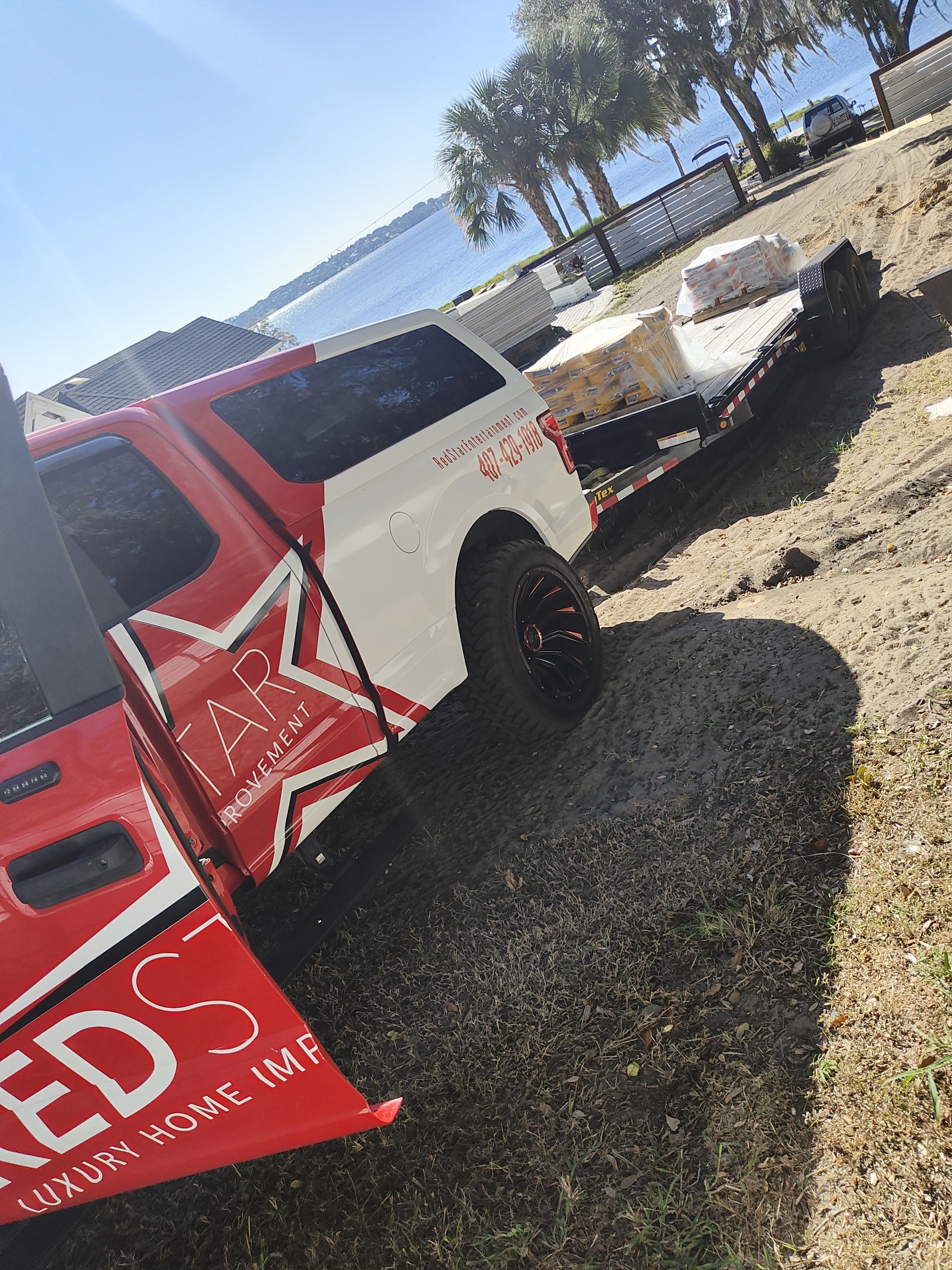 The iconic Red Star Luxury Home Improvement branded truck on an active job site.